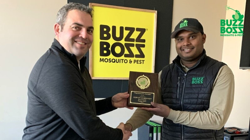 Buzz Boss receiving an award