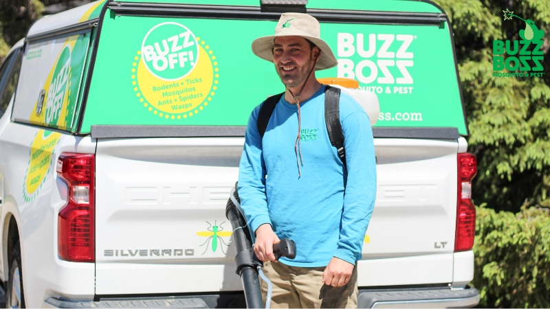 Buzz Boss worker in front of a truck